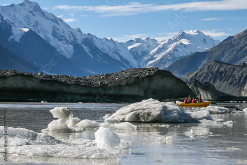 Landscape view of Icebergs in the glacial lake at the foot of the Tasman glacier, Aoraki National Park, New Zealand photo