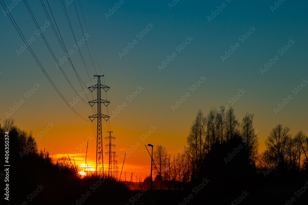 High voltage towers aganist the beautiful sunset