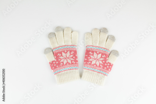 women's winter knitted mittens on a white background