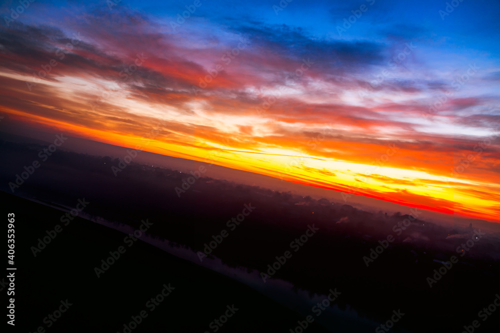 Rustic panorama in the twilight . Fantastic evening in the village . Aerial view of river and village in the dusk Rustic panorama in the twilight . Fantastic evening in the village . Aerial view of river and village in the dusk