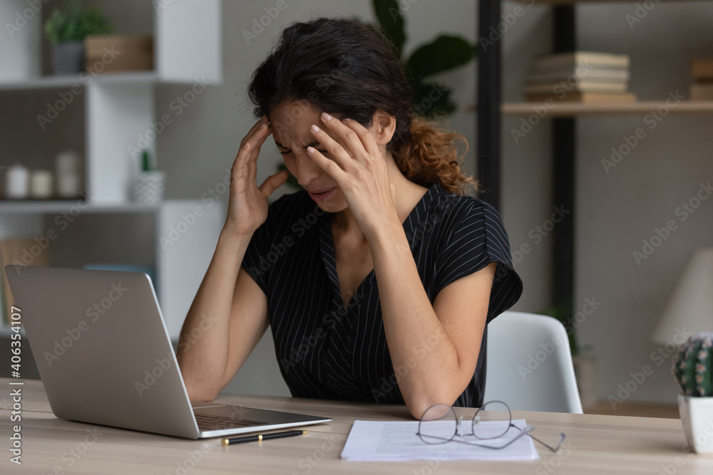Sick exhausted Caucasian female work on laptop struggle with migraine or headache. Tired unwell young woman take off glasses overwhelmed with computer job suffer from blurry vision or dizziness. Sick exhausted Caucasian female work on laptop struggle with migraine or headache. Tired unwell young woman take off glasses overwhelmed with computer job suffer from blurry vision or dizziness.
