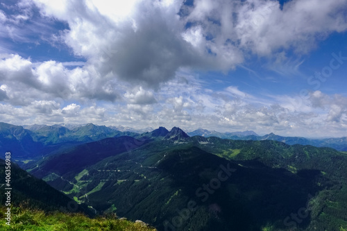 wonderful mountain landscape with clouds on the blue sky