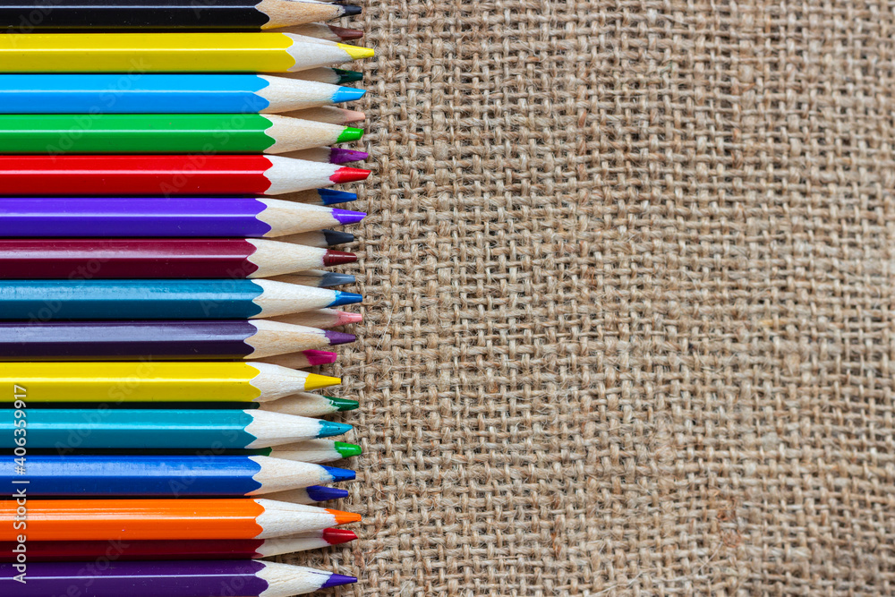 Set of colorful pencils on burlap. Set of colorful pencils on burlap.