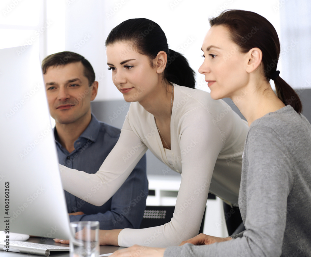 Group of business people discussing questions at meeting in modern office. Headshot at negotiation or workplace. Teamwork, partnership and business concept Group of business people discussing questions at meeting in modern office. Headshot at negotiation or workplace. Teamwork, partnership and business concept