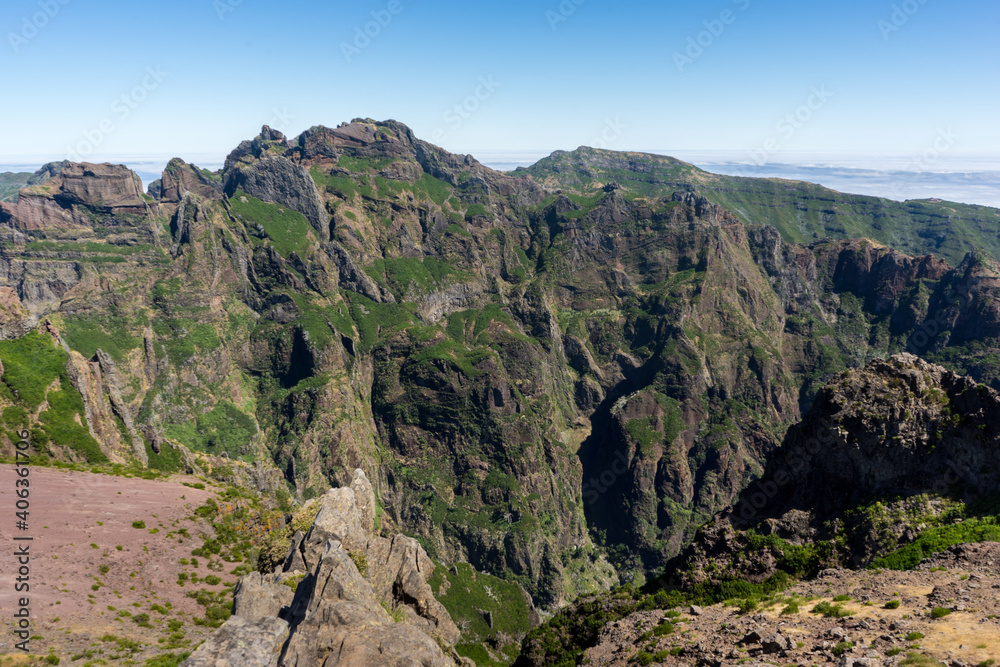 Beautiful panorama view of the landscape in the mountains at Pico do Areeiro with blue sky, Madeira Island Beautiful panorama view of the landscape in the mountains at Pico do Areeiro with blue sky, Madeira Island