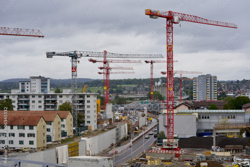 Construction site with many cranes. Photo taken at Zurich Schwamendingen, Switzerland, September 26, 2020.