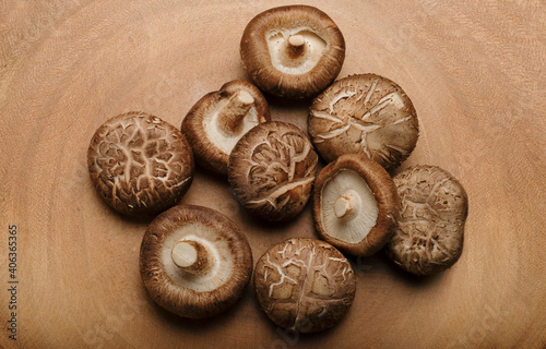 Shiitake Mushroom on Wooden cutting board, top view.
