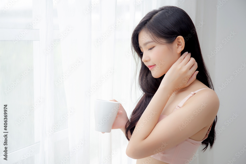Beautiful young asian sexy woman in underwear drinking coffee near windows in the morning, girl with seductive figure fit drinking beverage for relax and resting after wake up, lifestyle concept. Beautiful young asian sexy woman in underwear drinking coffee near windows in the morning, girl with seductive figure fit drinking beverage for relax and resting after wake up, lifestyle concept.