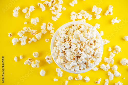 Salt popcorn on a yellow background