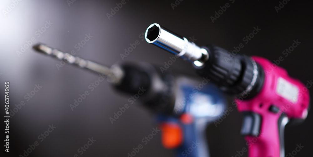 Fototapeta premium A screw gun and a pistol-grip cordless drill