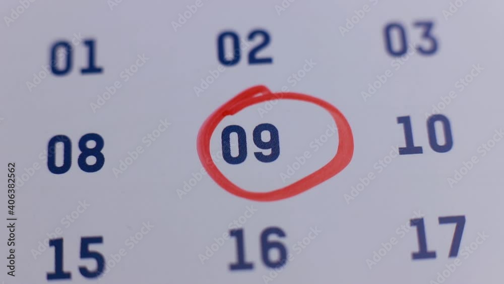 red marker pen circling the date 9 on the calendar red marker pen circling the date 9 on the calendar
