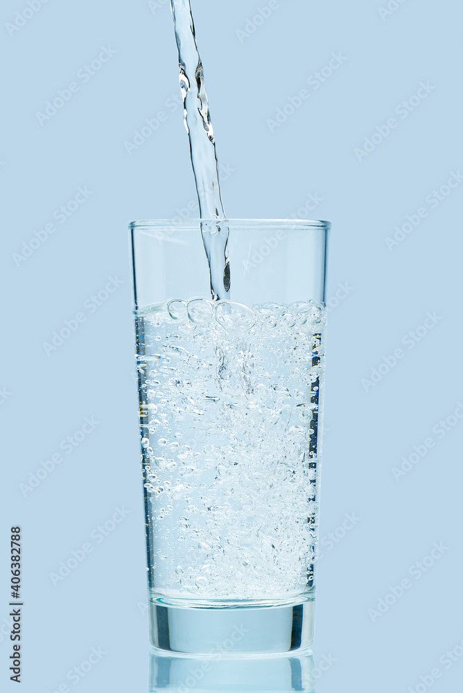 Pouring water. Pouring fresh clean drinking water to glass. Pouring water. Pouring fresh clean drinking water to glass.