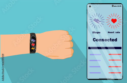 Fitness tracker on hand. App on the phone.The tracker shows the number of steps. The application on the phone shows the number of steps taken. App on the phone with heartbeat tracking.