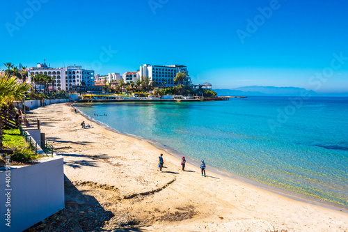 Fototapeta Naklejka Na Ścianę i Meble -  Walking on the Kadinlar Beach in Kusadasi Town of Turkey.