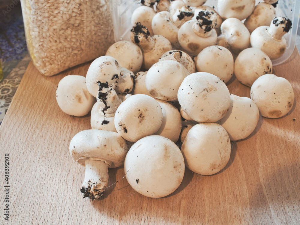 Raw ingredients to prepare a risotto with champignons mushrooms Raw ingredients to prepare a risotto with champignons mushrooms