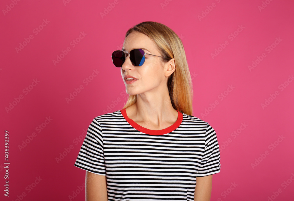 Beautiful woman in stylish sunglasses on pink background Beautiful woman in stylish sunglasses on pink background