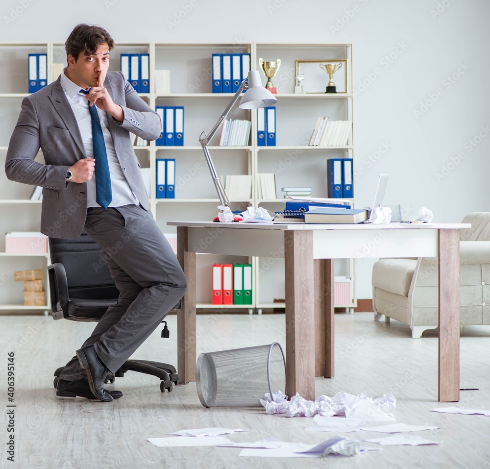 Businessman having fun taking a break in the office at work Businessman having fun taking a break in the office at work
