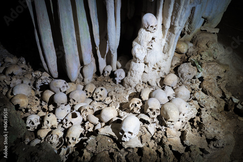 Skulls in cannibal skull cave in Papua New Guinea  photo