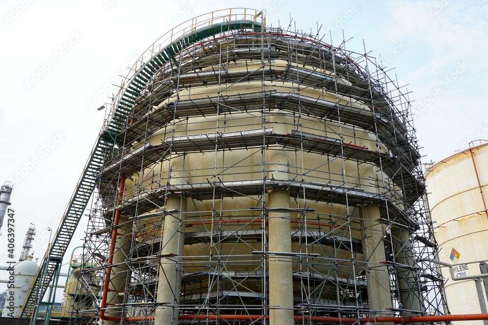 Large industrial tanks or spherical tanks and have scaffold installation work for petrochemical plant, oil and gas fuel or water in refinery or power plant for industrial plant.