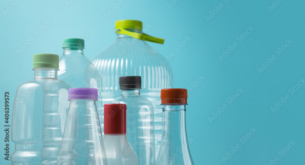 Varieties of Used Plastic Bottles Isolated on blue background. Reuse, Recycle and Zero Waste Campaign Varieties of Used Plastic Bottles Isolated on blue background. Reuse, Recycle and Zero Waste Campaign
