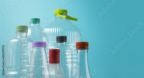 Varieties of Used Plastic Bottles Isolated on blue background. Reuse  Recycle and Zero Waste Campaign