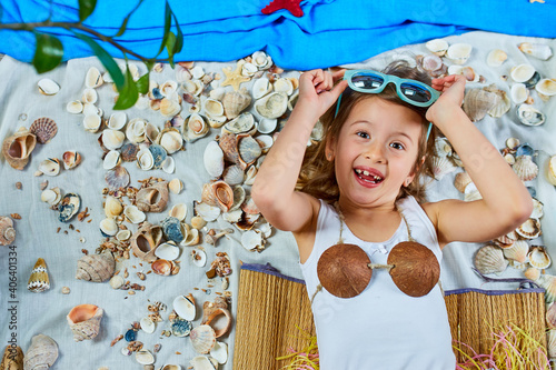 Little girl imitates Havaii vacation at home quarantine. photo