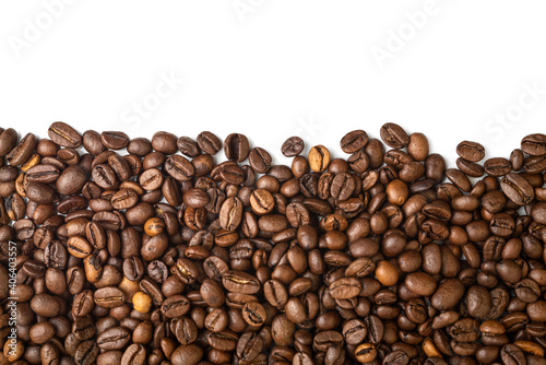 Roasted Coffee Beans background texture, isolated on white background frame on the bottom with copy space for text on the top, macro detailed photo.