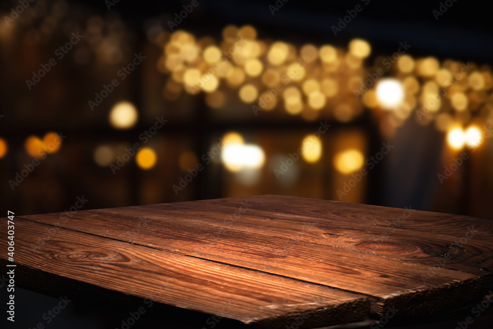 blurred background of cafe and dark brown wood desktop in retro style