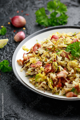 Fried Brussels sprouts with rice and crispy bacon