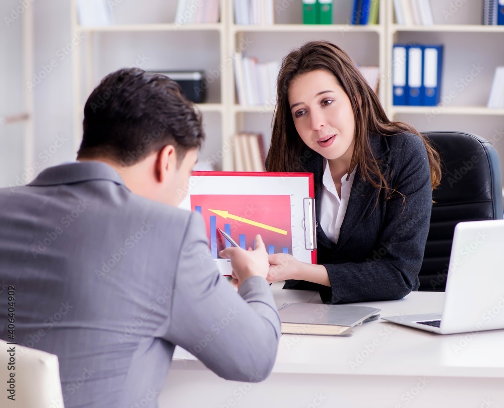Business meeting between businessman and businesswoman Business meeting between businessman and businesswoman