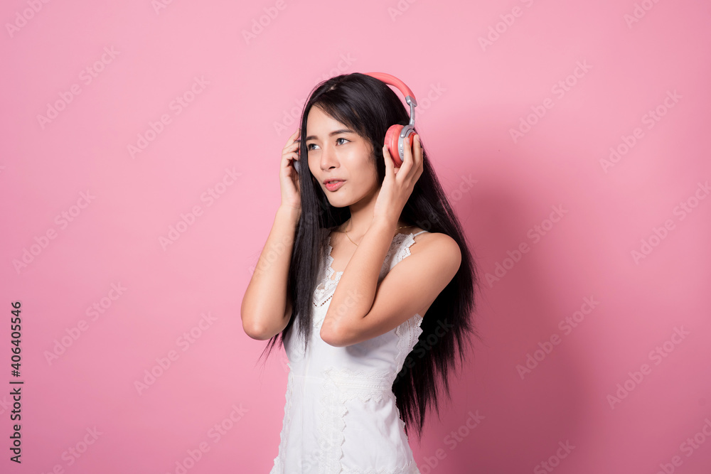 Happy cheerful young woman wearing her black hair rejoicing at positive news or birthday gift, looking at camera with joyful and charming smile. Asian girl portrait on pink background in studio Happy cheerful young woman wearing her black hair rejoicing at positive news or birthday gift, looking at camera with joyful and charming smile. Asian girl portrait on pink background in studio