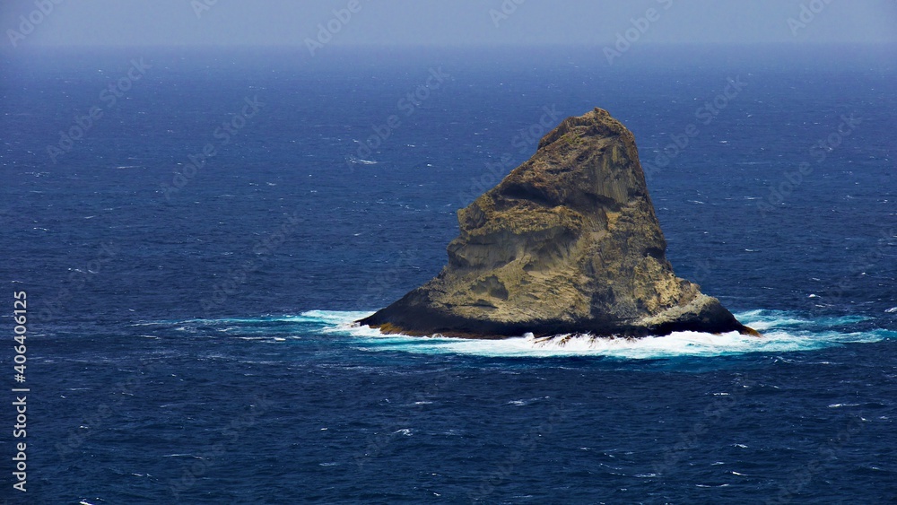 remote sugar loaf island in agitated ocean
