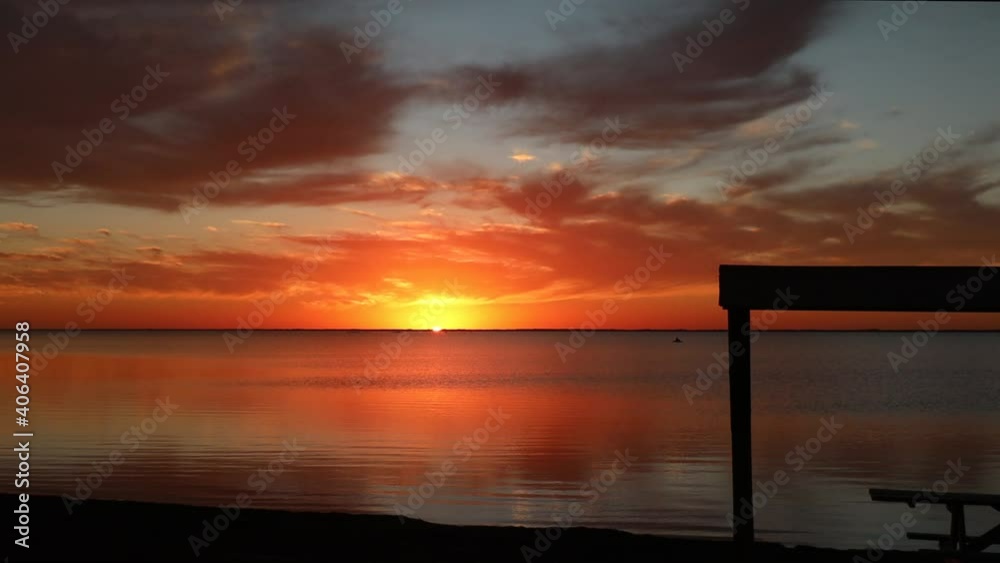 Glorious sunset over a calm Laguna Madres estuary at North Padre Island National Seashore along Gulf Coast of Texas Glorious sunset over a calm Laguna Madres estuary at North Padre Island National Seashore along Gulf Coast of Texas