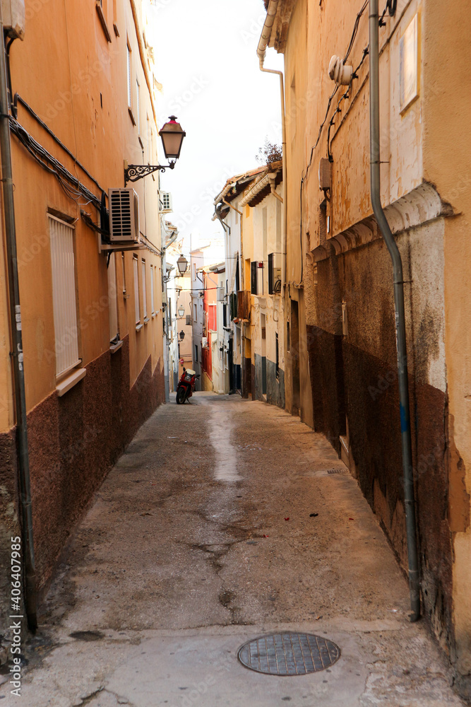 cosy beautiful narrow street in old spanish town Xativa, province of Valencia