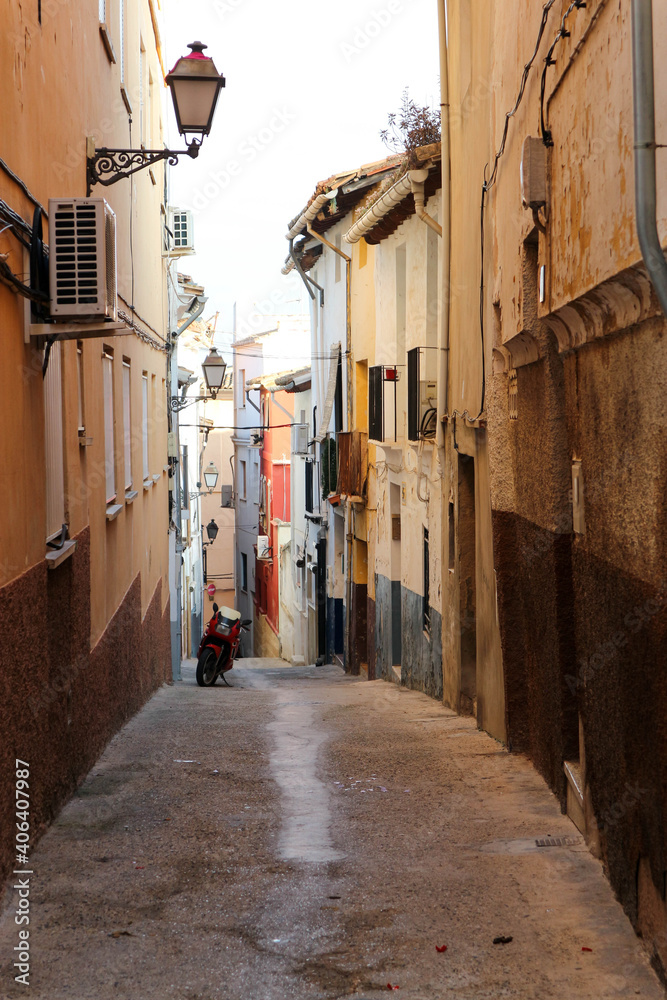 cosy beautiful narrow street in old spanish town Xativa, province of Valencia