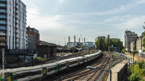 Timelapse of Battersea with train lines and a power station in the background photo