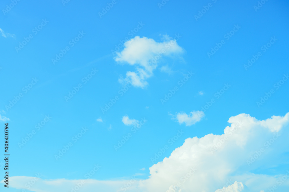 View of beautiful white clouds in a blue sky,blue sea on sunny day with cloudy sky over it. View of beautiful white clouds in a blue sky,blue sea on sunny day with cloudy sky over it.