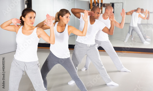 Men and women train in self defense courses in the gym