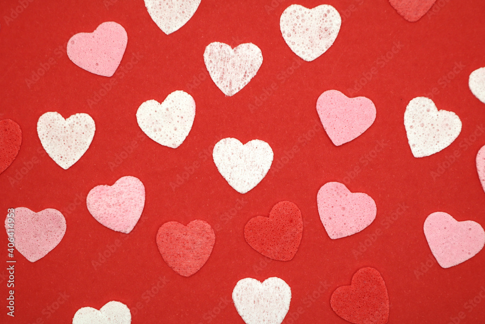 Red pink and white hearts on a red background. Valentine's day concept. Selective focus. Postcard. Background. Red pink and white hearts on a red background. Valentine's day concept. Selective focus. Postcard. Background.