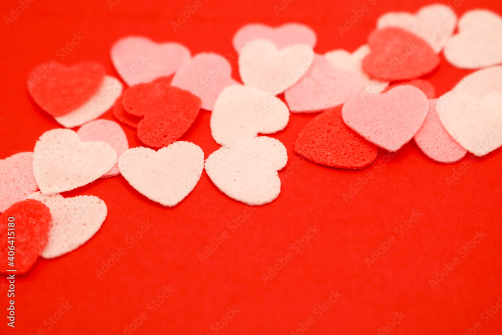 Red pink and white hearts on a red background. Valentine's day concept. Selective focus. Postcard. Background. Red pink and white hearts on a red background. Valentine's day concept. Selective focus. Postcard. Background.