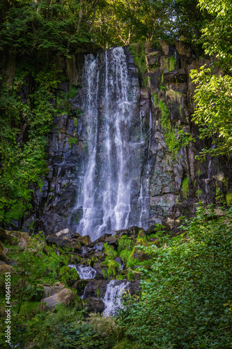 Fototapeta Naklejka Na Ścianę i Meble -  Beautiful waterfall in a lush forest near Besse en Chandesse in Auvergne, France. The name of the waterfall is 