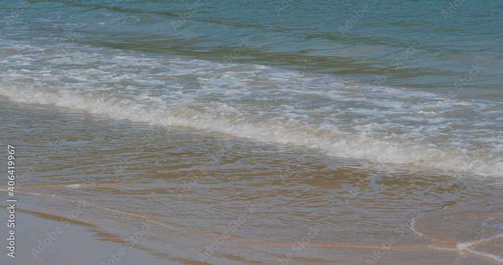 Sea wave over sand beach Sea wave over sand beach