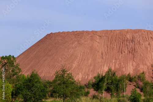 open pit for mining red granite in spring