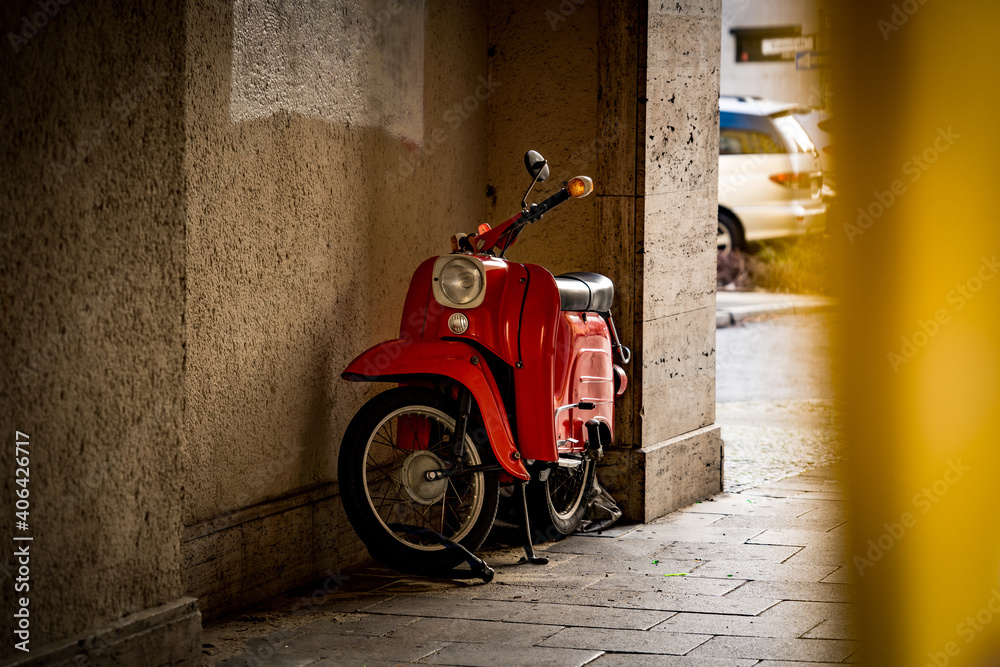 red scooter in backalley of berlin