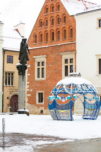 Snowy winter in Krakow, Saint Mary Magdalene Square and monument to Piotr Skarga, Christmas decoration, Krakow, Poland