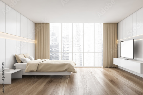 Beige wooden bedroom with beige bed and TV set on parquet floor