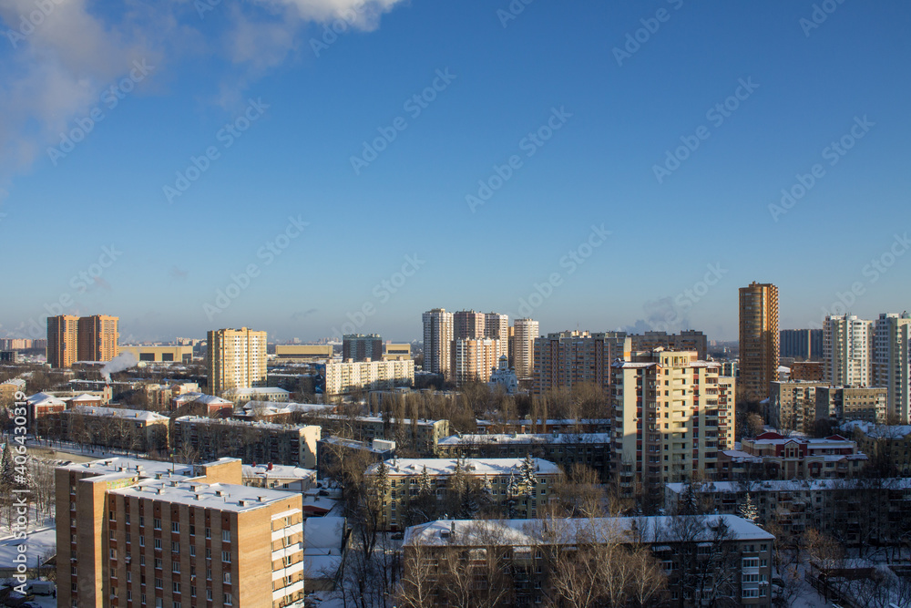 top panoramic view of the city with modern high residential buildings on a frosty winter sunny day against a clear blue sky and space to copy in Reutov Moscow Region Russia