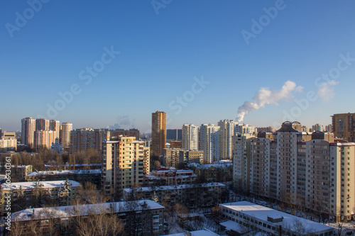 top panoramic view of the city with modern high residential buildings on a frosty winter sunny day against a clear blue sky and space to copy in Reutov Moscow Region Russia