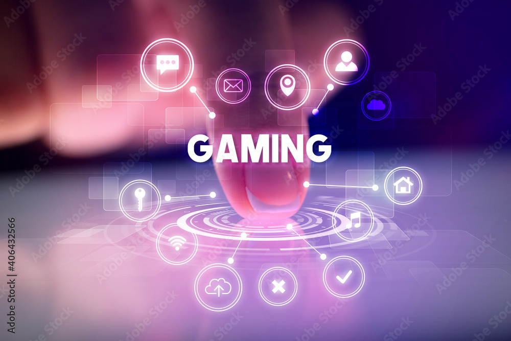Finger touching tablet with web technology icons and GAMING inscription, web technology concept Finger touching tablet with web technology icons and GAMING inscription, web technology concept