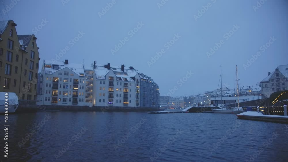 Moody dark snowy night in Aalesund, Brosundet Norway. Moody dark snowy night in Aalesund, Brosundet Norway.